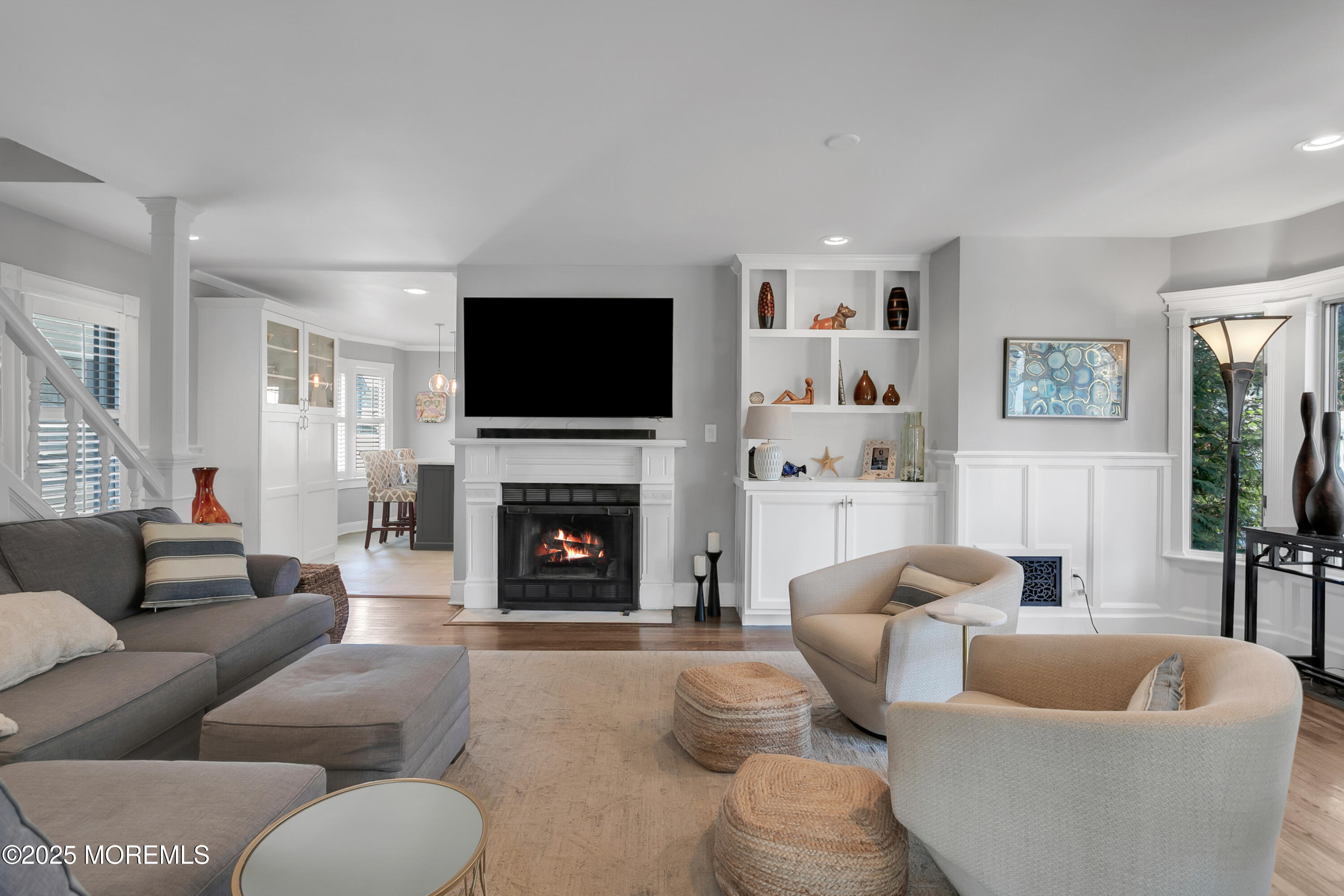 7 Allen Street Rumson, NJ 07760 - Photo 7 of 45 a living room with furniture a flat screen tv and a fireplace