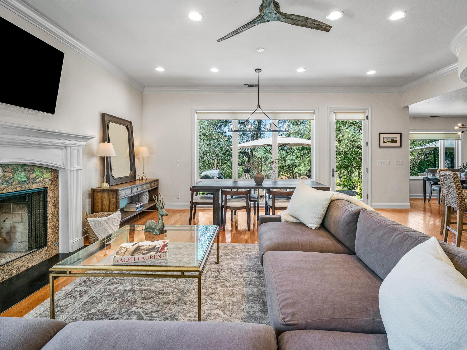 5080 Gold Hill Road Placerville, CA 95667 - Photo 6 of 63 Living room with wood fireplace and big picture windows overlooking backyard.