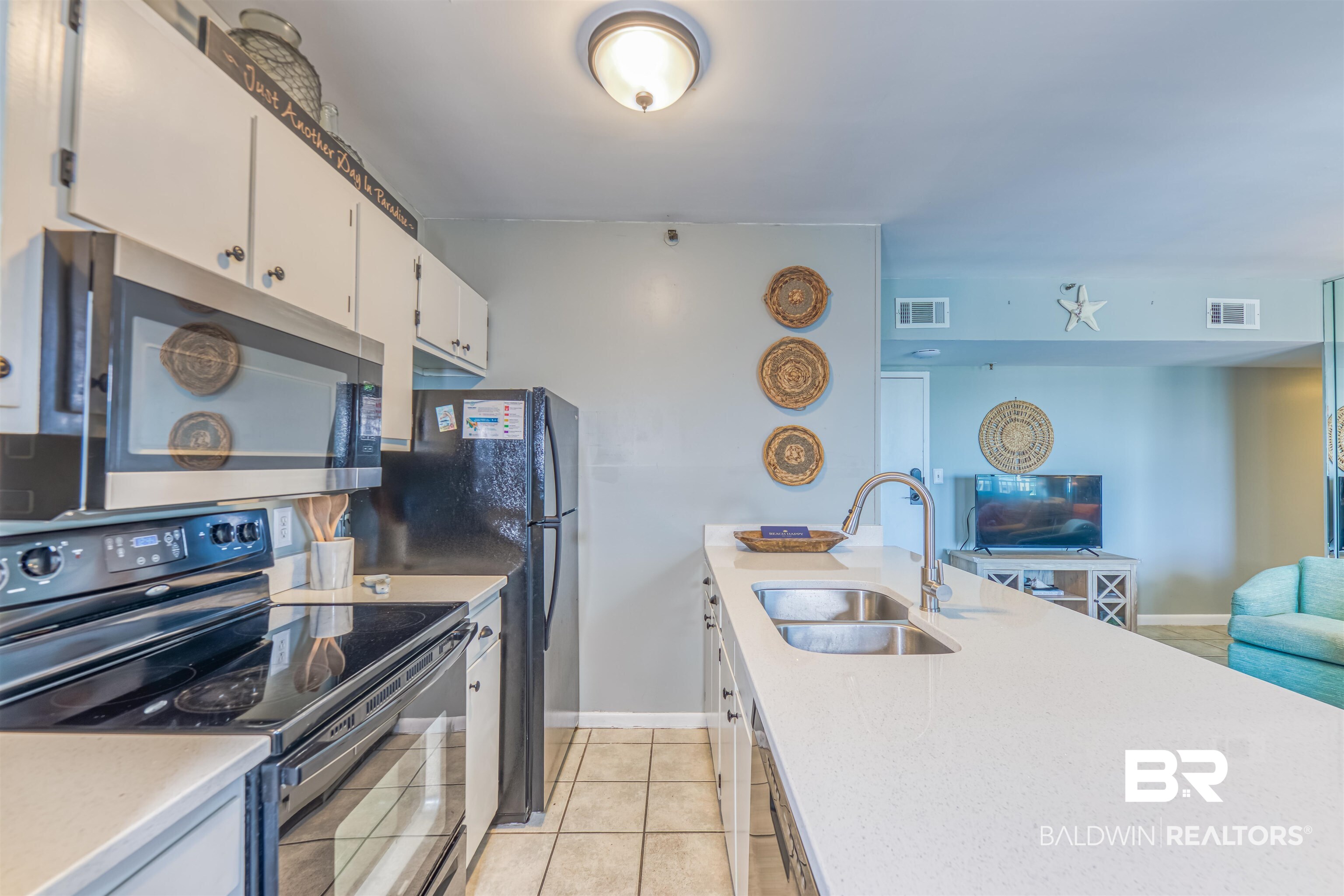 375 Plantation Road, Unit 5406 Gulf Shores, AL 36542 - Photo 23 of 23 Kitchen with range with electric cooktop, a sink, open floor plan, stainless steel microwave