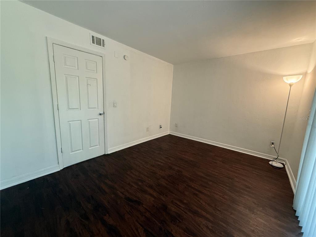 510 Southwest 69th Street, Unit A Gainesville, FL 32607 - Photo 9 of 9 a view of an empty room with wooden floor