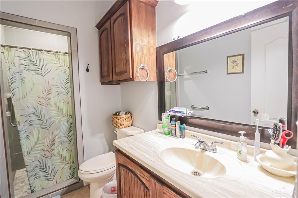 4701 Russell Circle Mission, TX 78574 - Photo 15 of 41 a bathroom with a sink toilet and shower