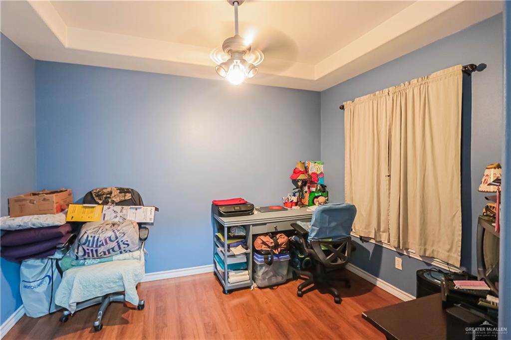 4701 Russell Circle Mission, TX 78574 - Photo 19 of 41 a living room with furniture and a wooden floor