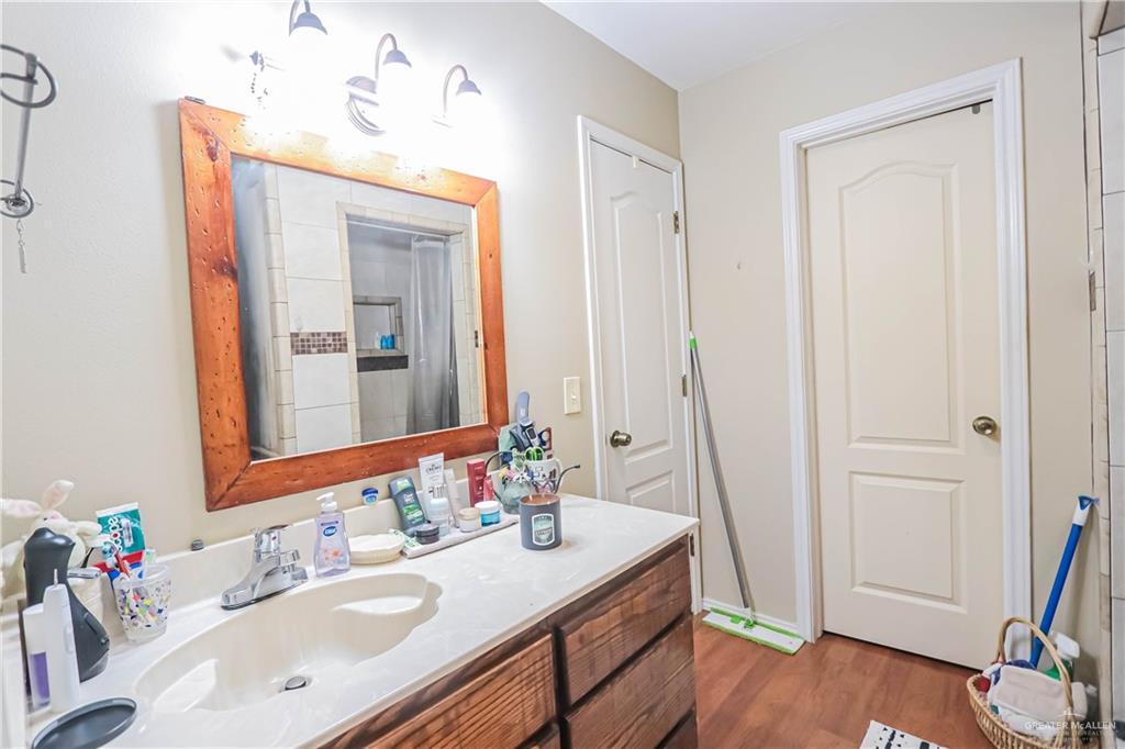 4701 Russell Circle Mission, TX 78574 - Photo 21 of 41 a bathroom with a sink vanity and a mirror
