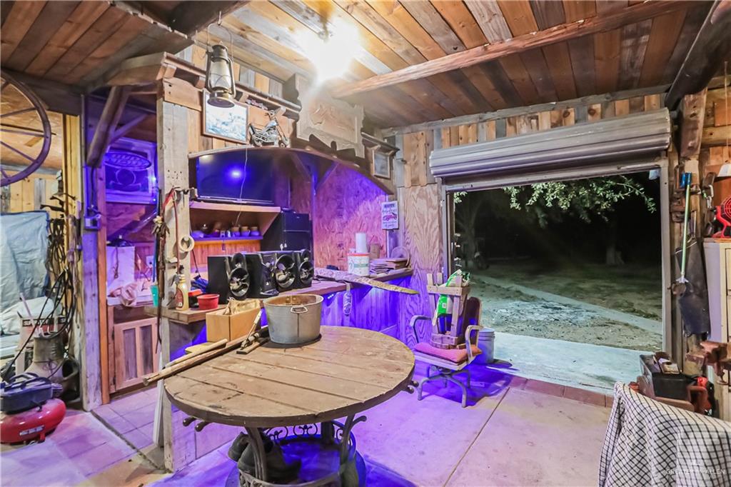 4701 Russell Circle Mission, TX 78574 - Photo 29 of 41 Playroom featuring wooden walls and unfinished concrete flooring