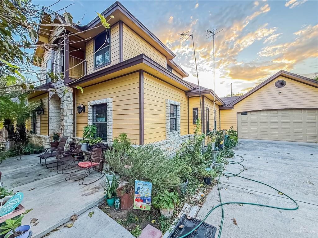 4701 Russell Circle Mission, TX 78574 - Photo 3 of 41 View of property exterior with a garage, a patio area, and a balcony