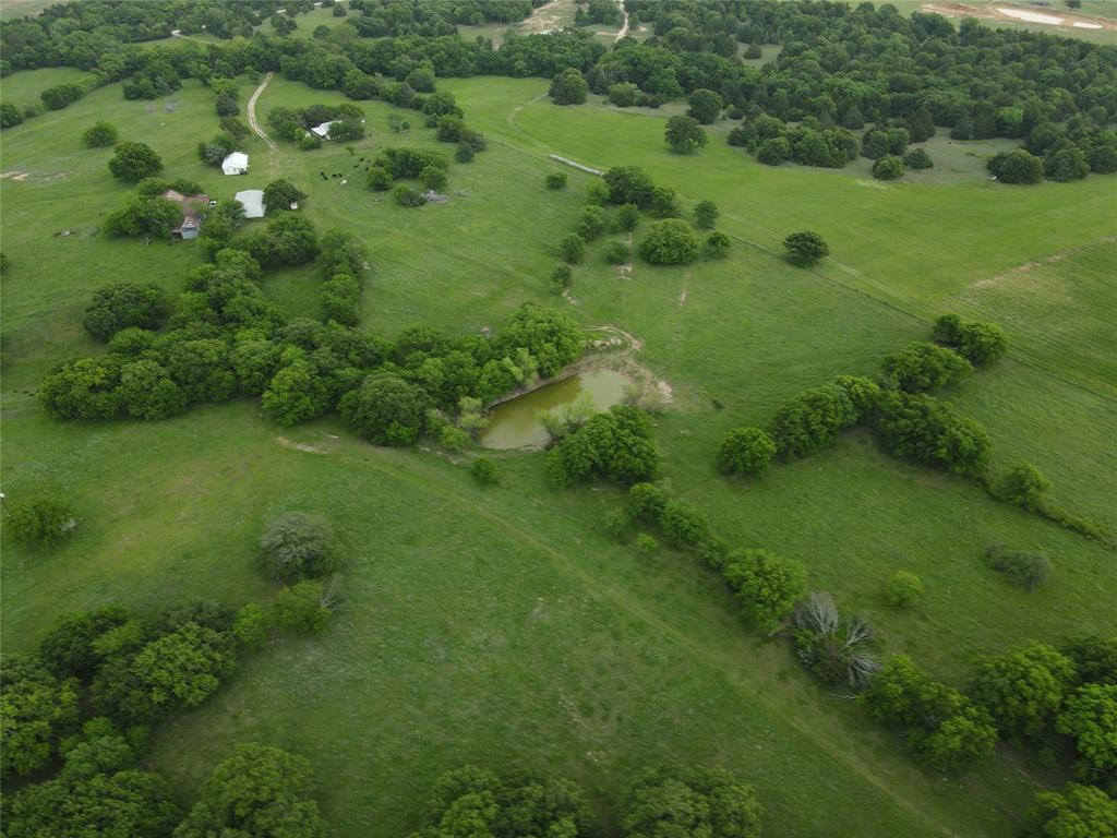 5444 Well Service Road Bowie, TX 76230 - Photo 2 of 38 a view of a lush green space
