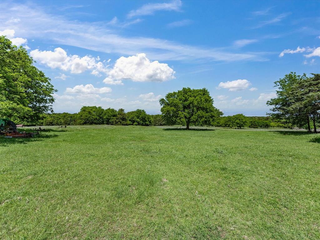 5444 Well Service Road Bowie, TX 76230 - Photo 9 of 38 a view of a lake with a yard