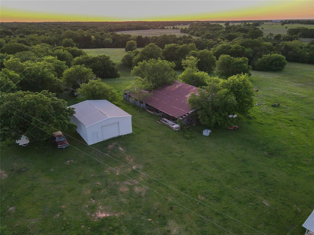 5444 Well Service Road Bowie, TX 76230 - Photo 10 of 38 a view of a house with a yard