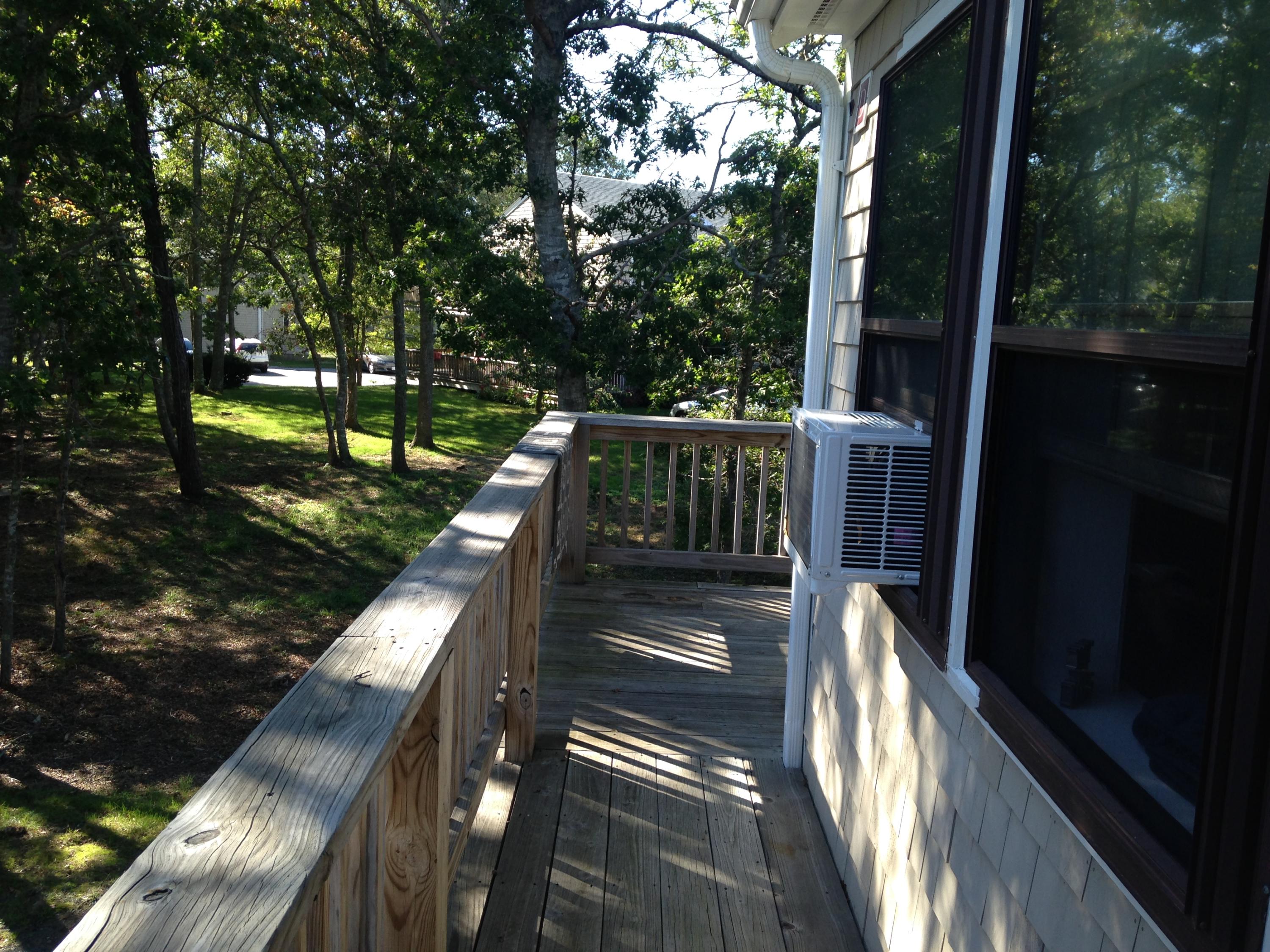 35 Ashumet Road, Unit 8D Mashpee, MA 02649 - Photo 11 of 16 a view of balcony with wooden floor
