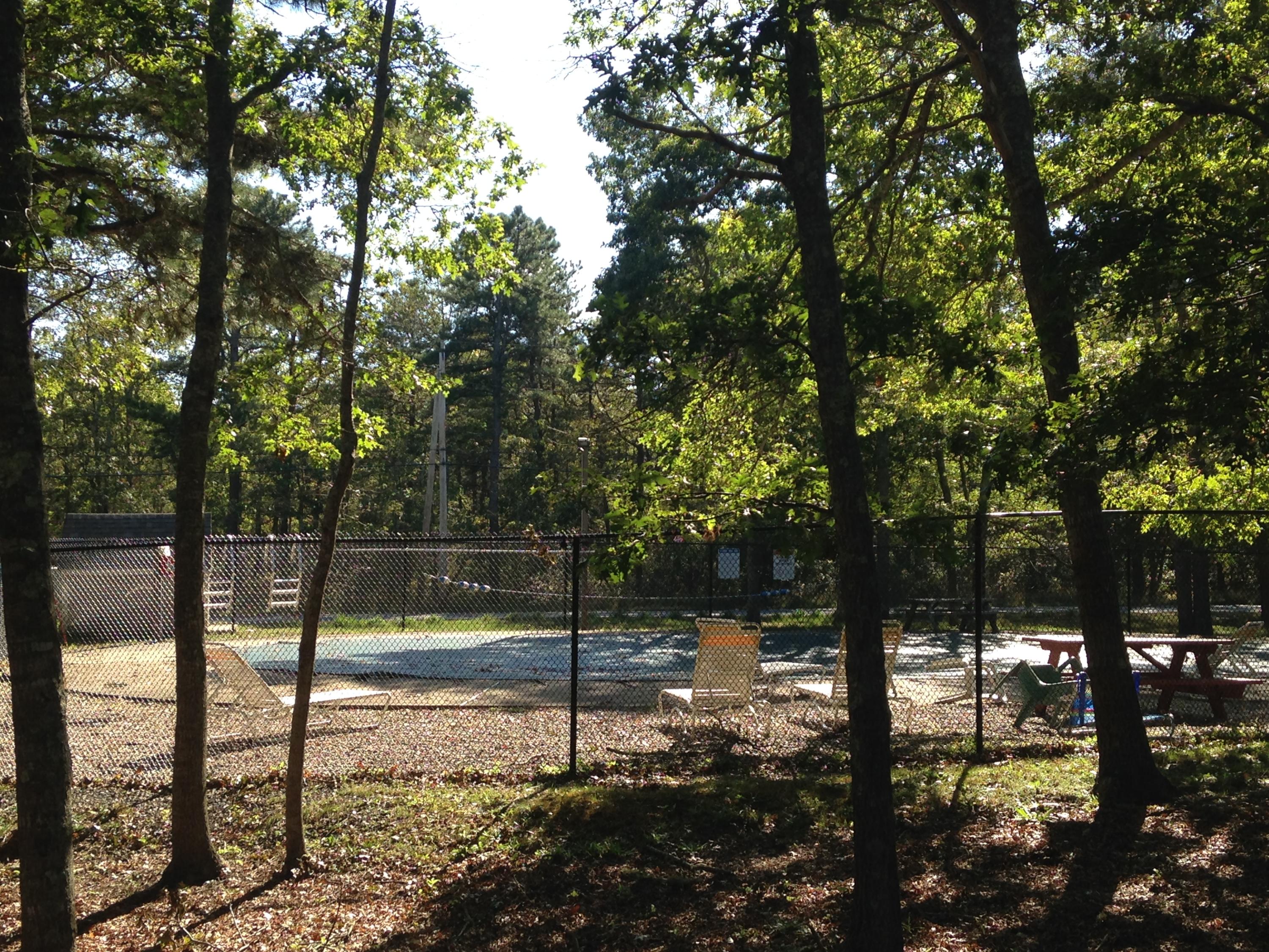 35 Ashumet Road, Unit 8D Mashpee, MA 02649 - Photo 13 of 16 a view of a yard with large trees