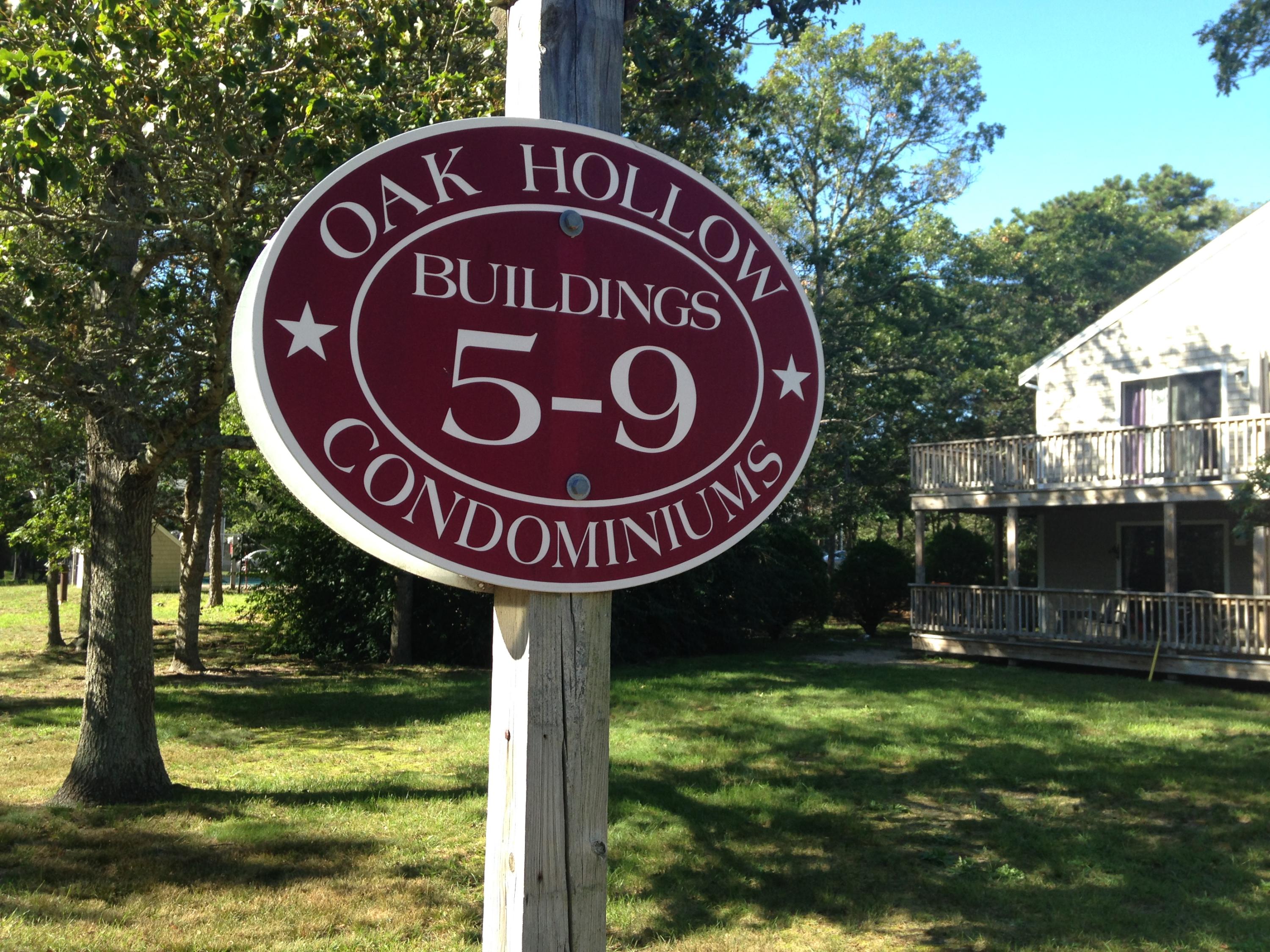 35 Ashumet Road, Unit 8D Mashpee, MA 02649 - Photo 14 of 16 a sign that is on a pole