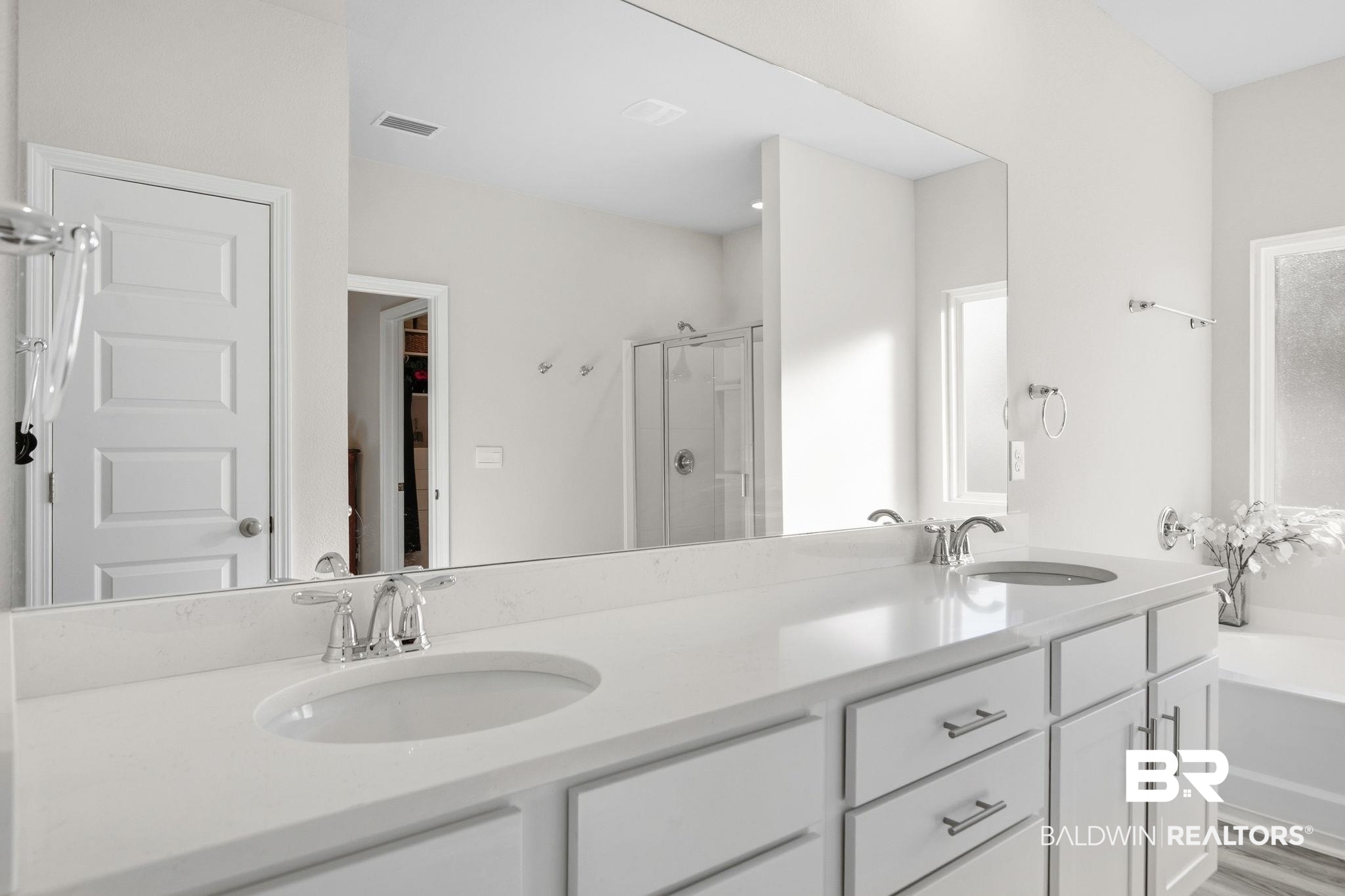 11123 Genuine Risk Circle Daphne, AL 36526 - Photo 29 of 67 Full bathroom featuring a stall shower, double vanity, and light wood-style floors