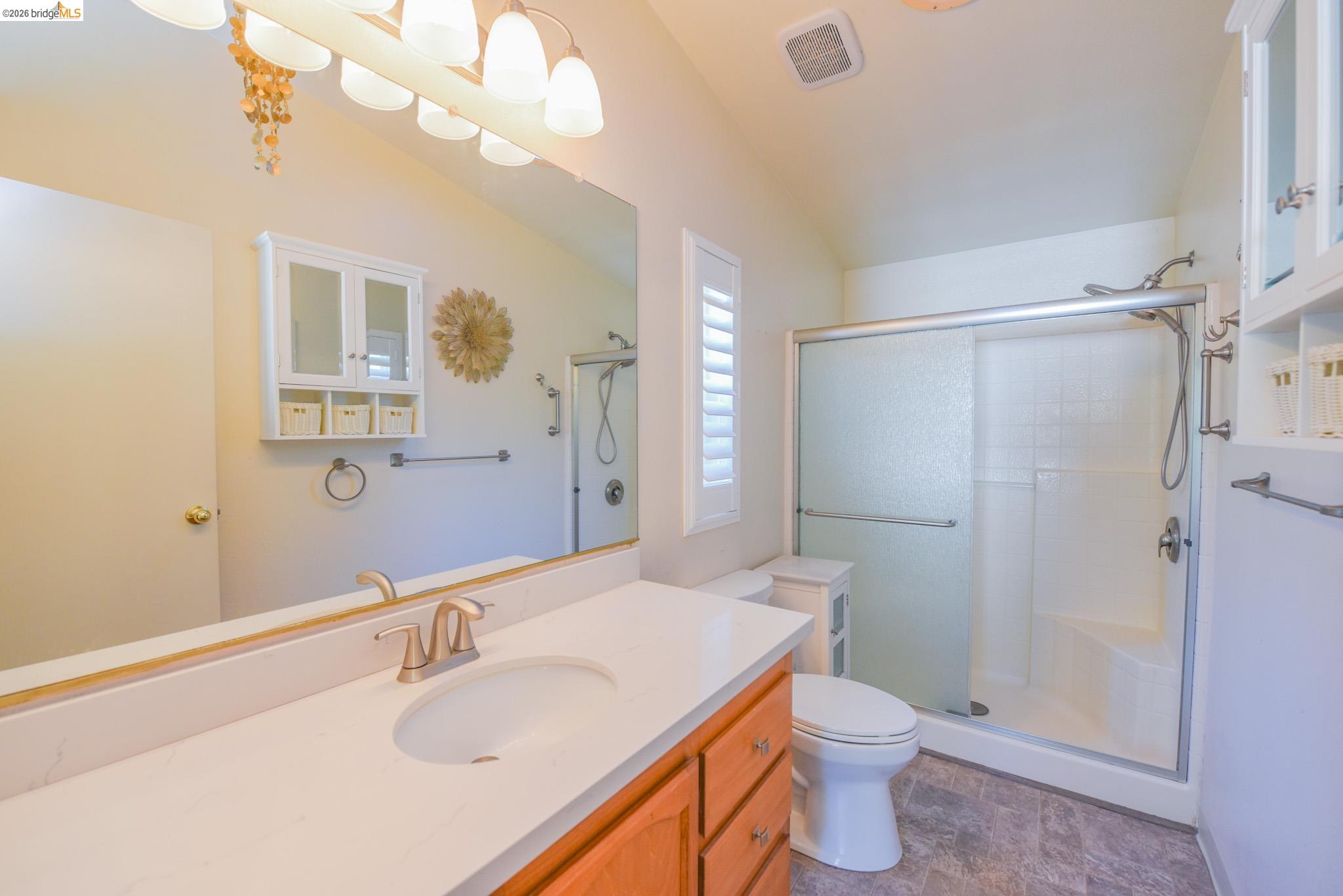 23732 Parrotts Ferry Road, Unit 47 Columbia, CA 95310 - Photo 19 of 21 a bathroom with a sink a toilet and shower