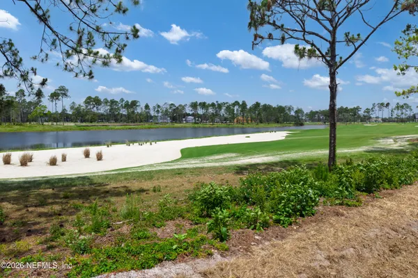 a view of a lake with a big yard