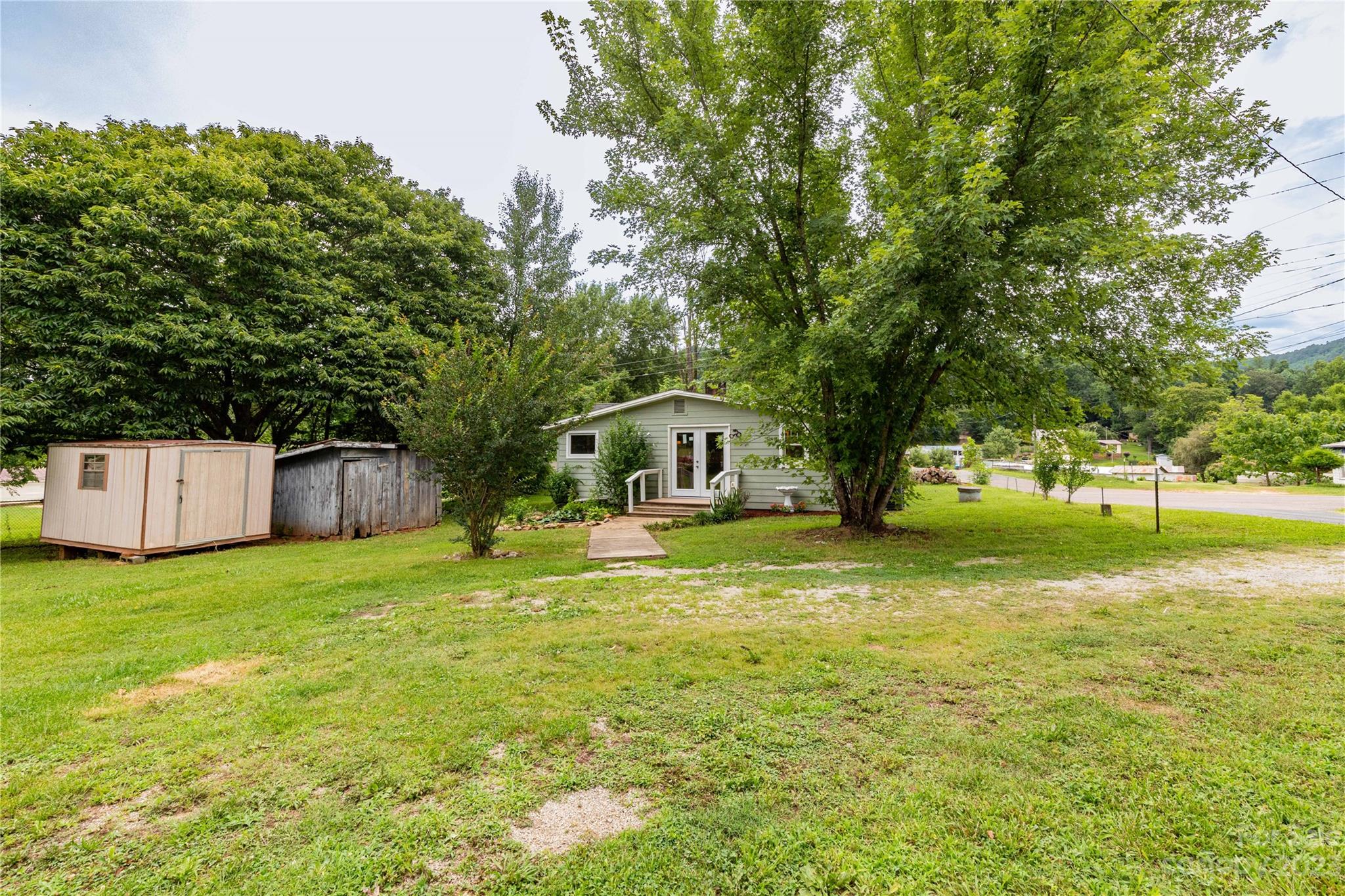 558 Jacktown Road Marion, NC 28752 - Photo 13 of 26 a house with trees in front of it