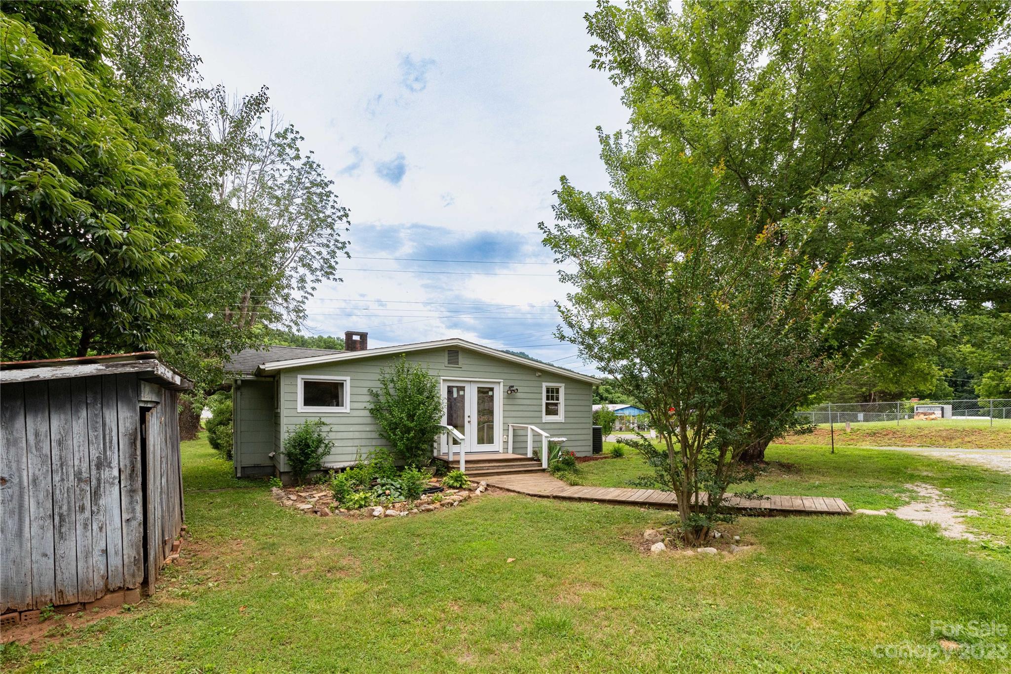 558 Jacktown Road Marion, NC 28752 - Photo 16 of 26 a view of a house with backyard and sitting area