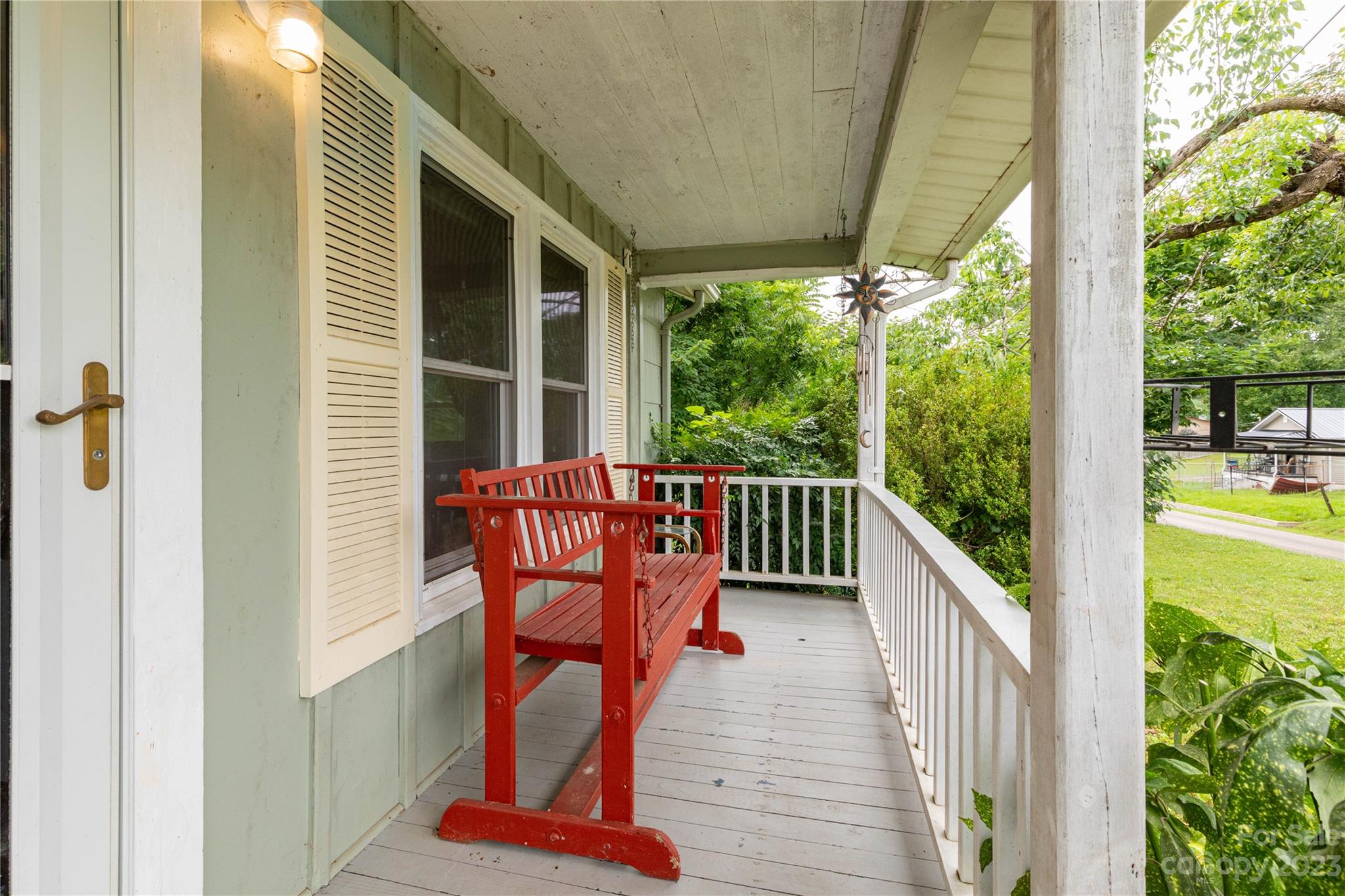 558 Jacktown Road Marion, NC 28752 - Photo 19 of 26 a balcony with wooden floor outdoor seating and yard in the back