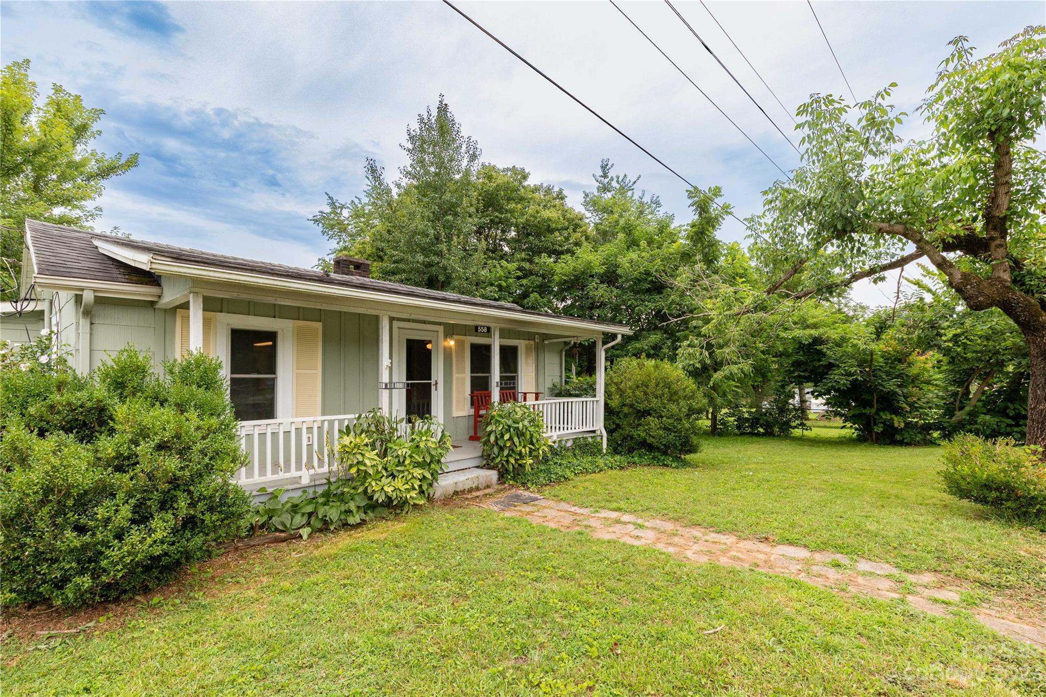 558 Jacktown Road Marion, NC 28752 - Photo 21 of 26 a view of a house with backyard and garden