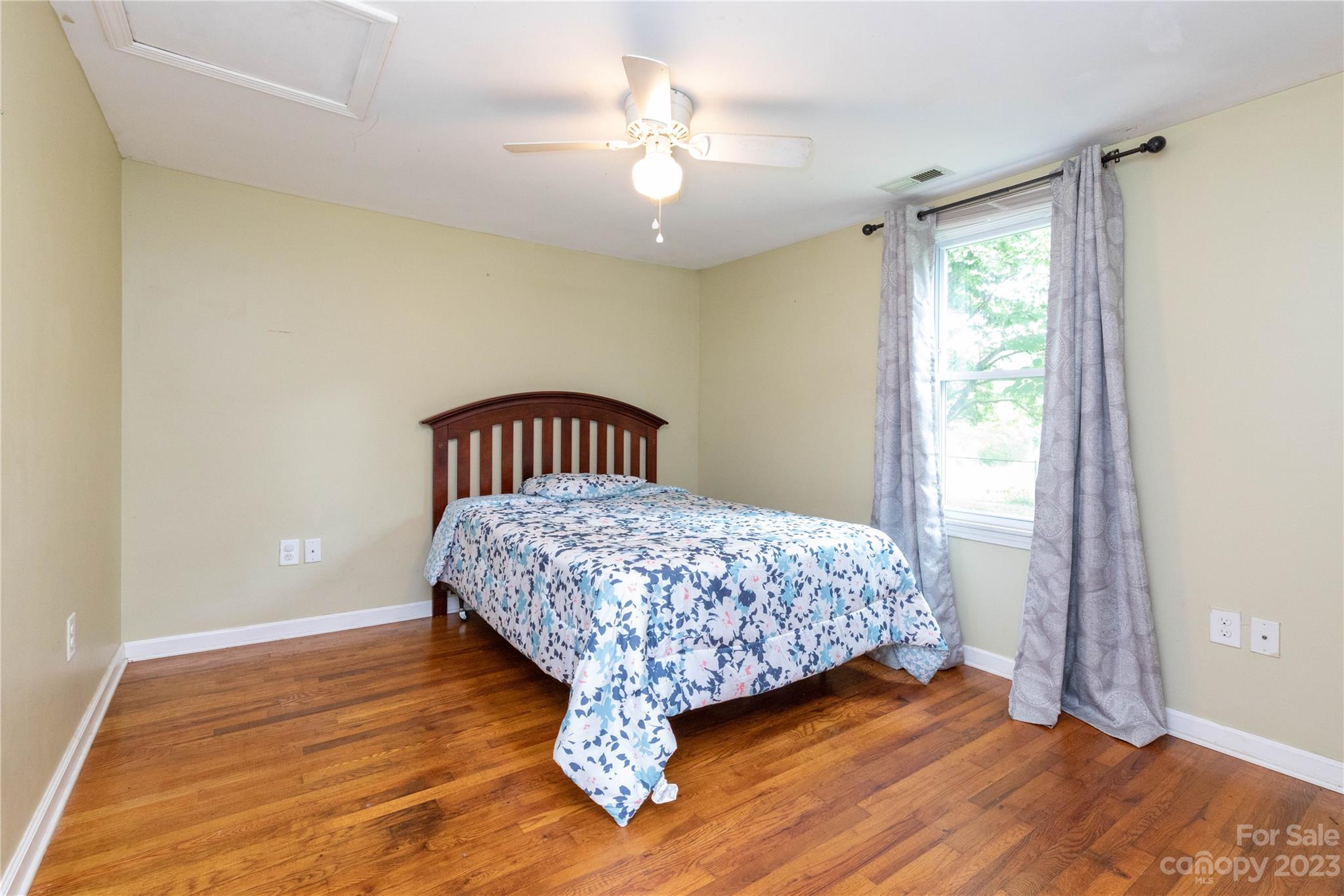 558 Jacktown Road Marion, NC 28752 - Photo 6 of 26 a bedroom with a bed and wooden floor