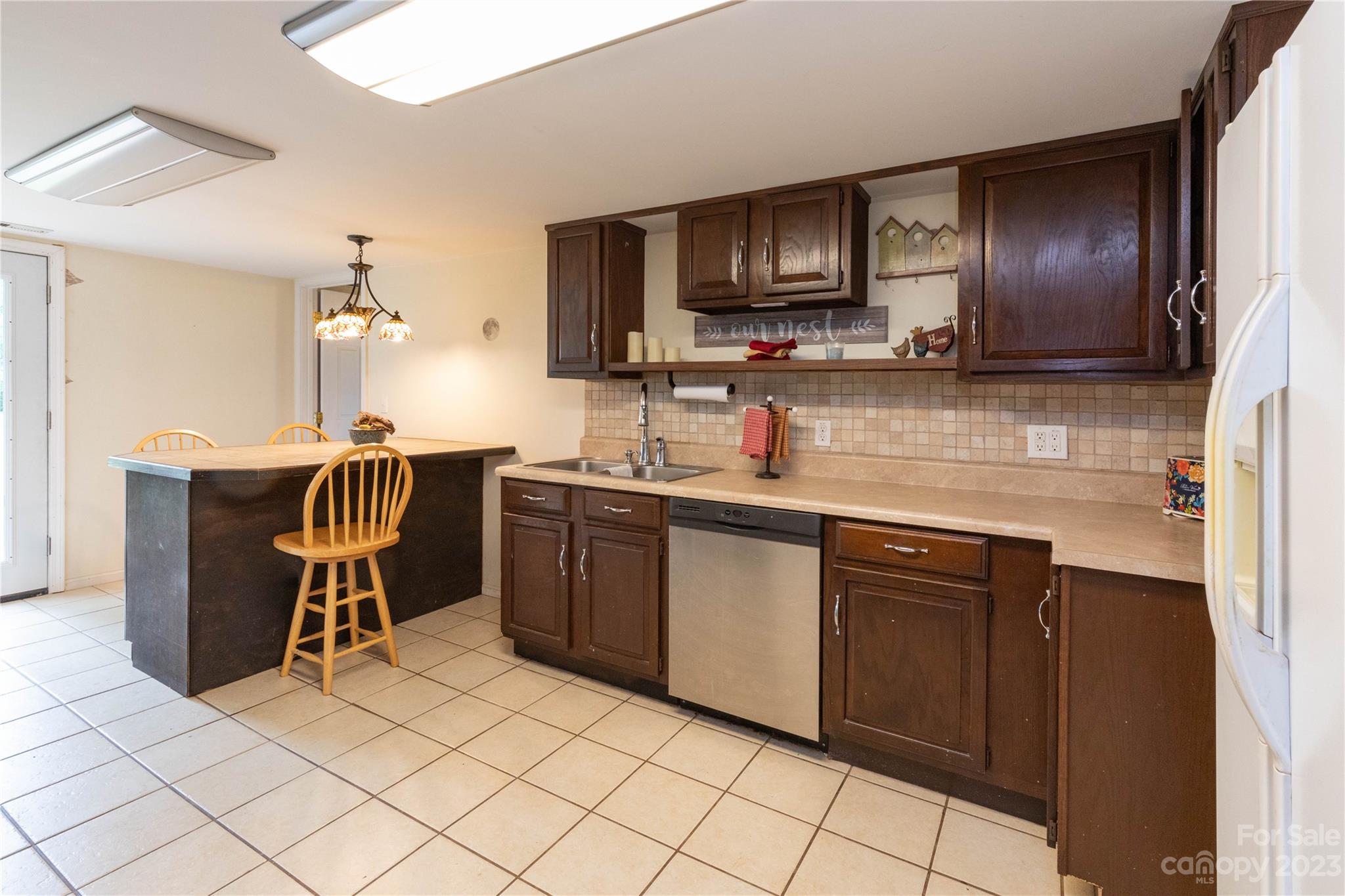 558 Jacktown Road Marion, NC 28752 - Photo 10 of 26 a kitchen with stainless steel appliances granite countertop a stove a sink a microwave and a refrigerator