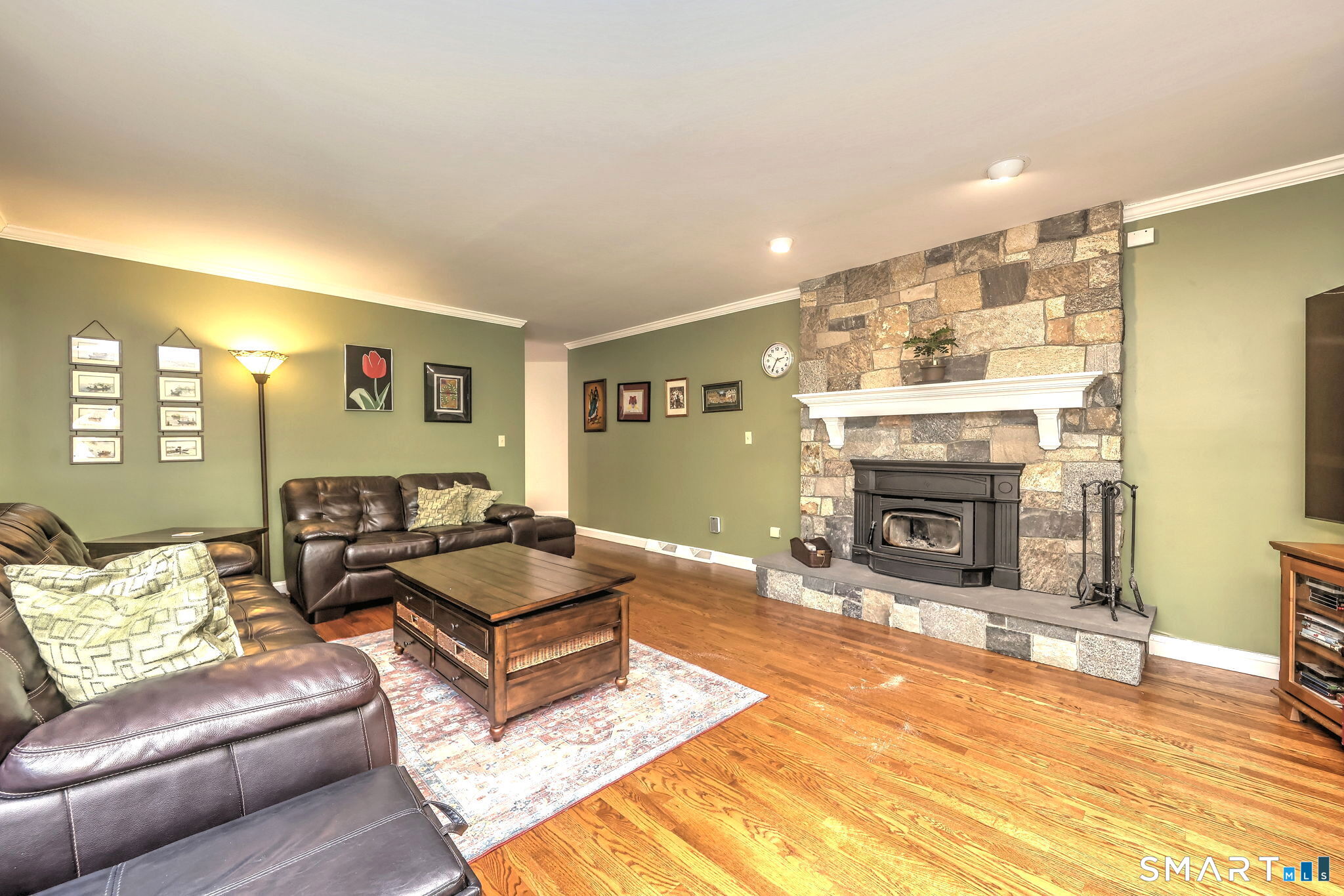 60 West Meadow Road Hamden, CT 06518 - Photo 14 of 35 The family room, right off the kitchen provides a comfortable, homey place to relax.Enjoy the attractive fireplace with stove insert ,toasty in the chilly months