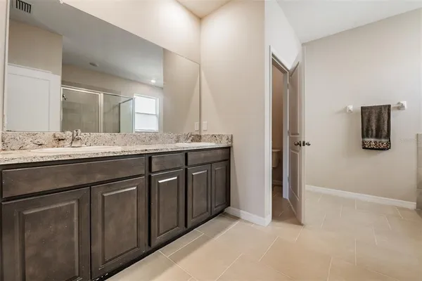 an aerial view of a houses with yard