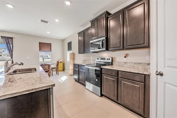 a view of a large body of water with a house in the background