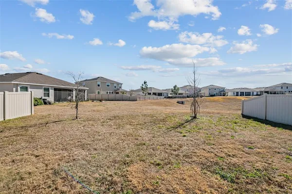 a kitchen with stainless steel appliances kitchen island granite countertop a refrigerator and a stove top oven