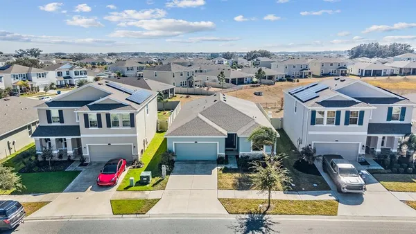 a large kitchen with stainless steel appliances lots of counter space and a sink