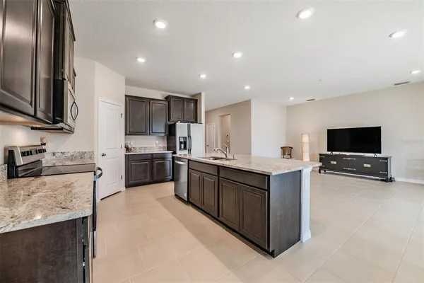 a white bath tub sitting next to a shower