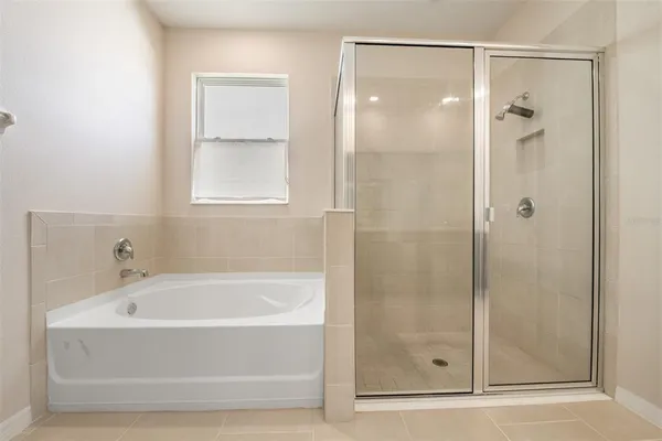 an aerial view of a houses with a swimming pool