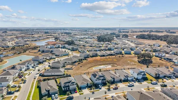 a view of a lake with a table and chairs