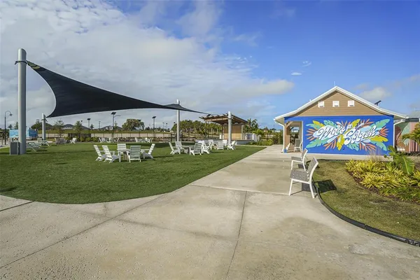 a view of a swimming pool with a table and chairs