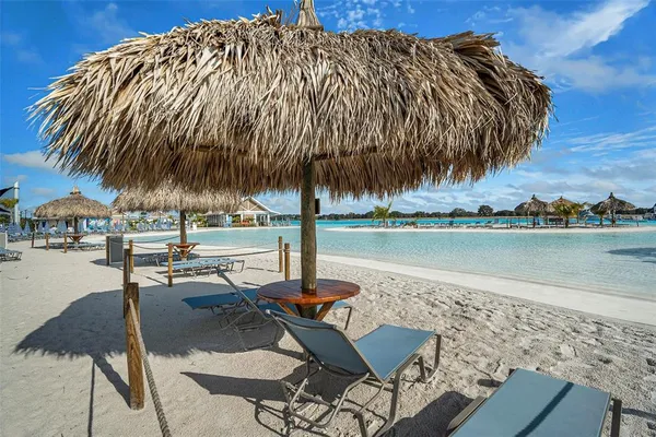a view of building with outdoor space and trees in the background
