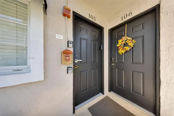 a view of an entryway door front of house