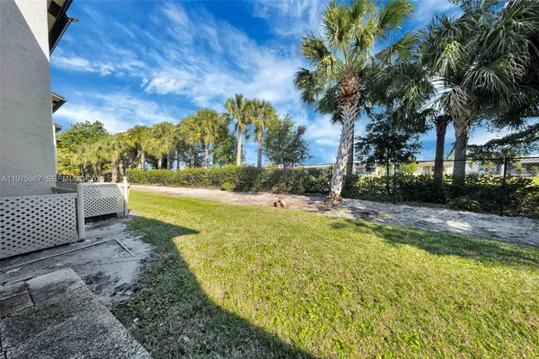 a view of yard with swimming pool and outdoor seating