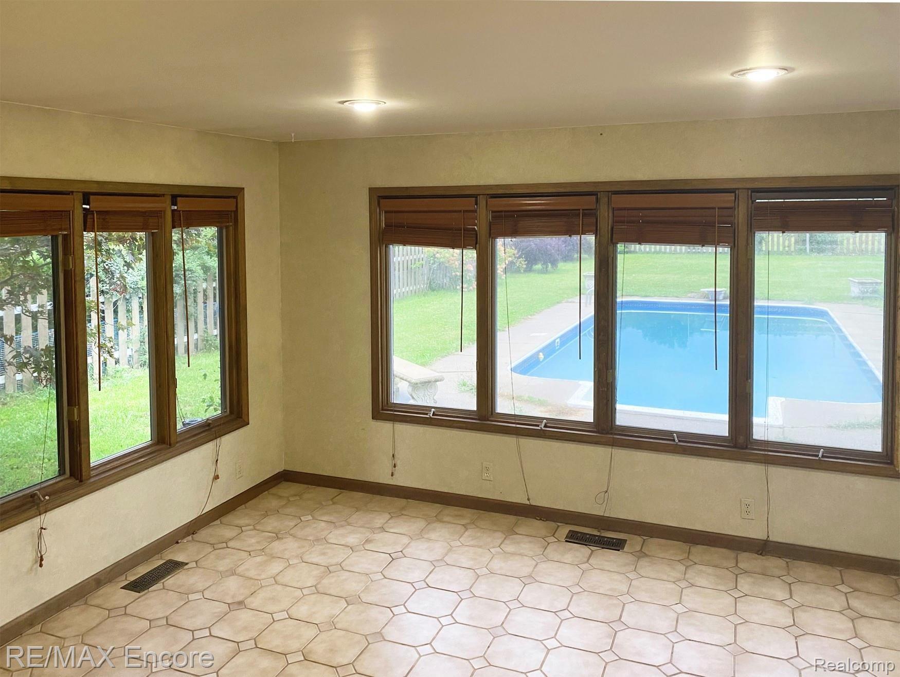 3201 North Hickory Ridge Road Highland, MI 48357 - Photo 7 of 16 N Hickory Ridge Kit view of pool.jpg