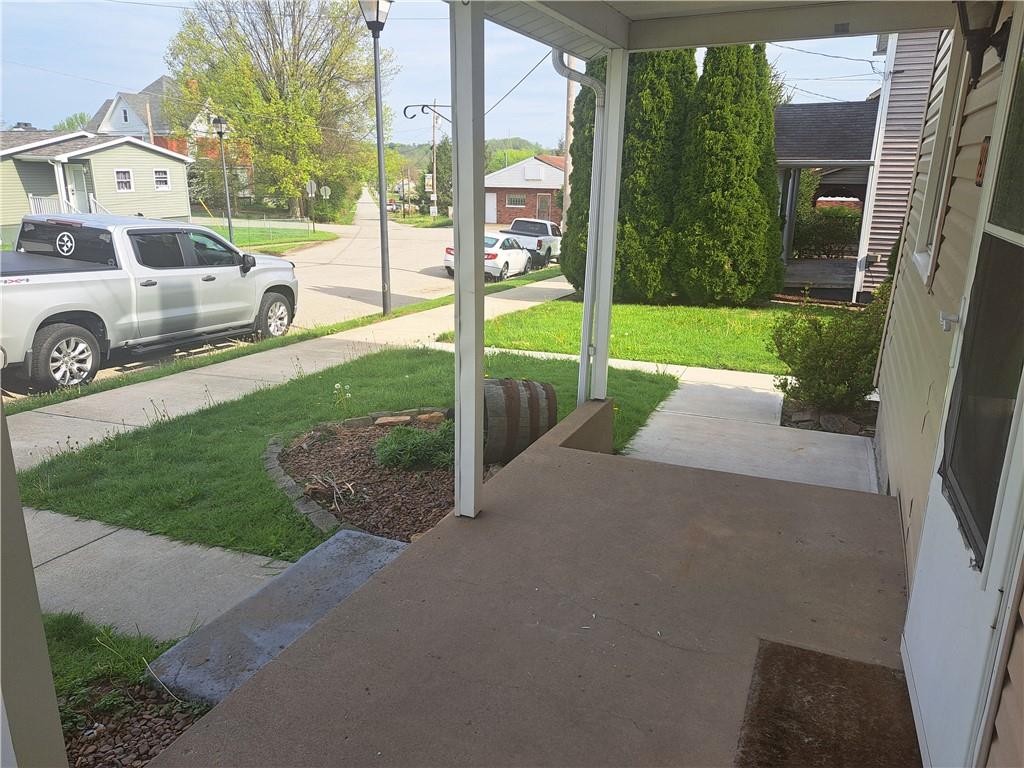 414 Liberty Street Perryopolis, PA 15473 - Photo 3 of 26 a house view with a garden space