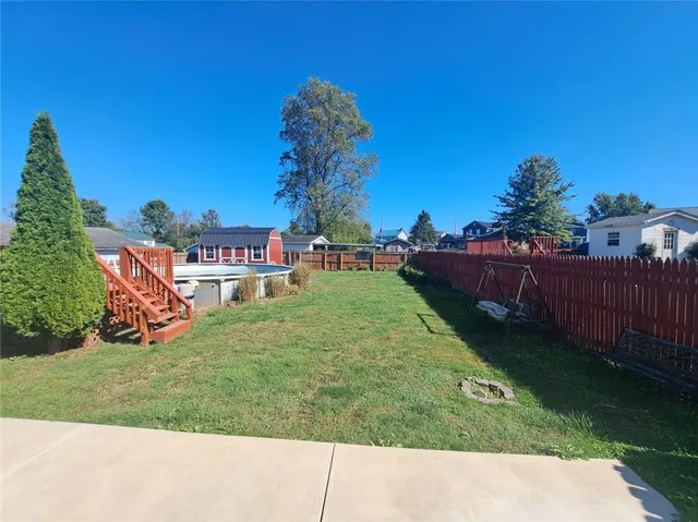 a childrens park with lots of swings and slides