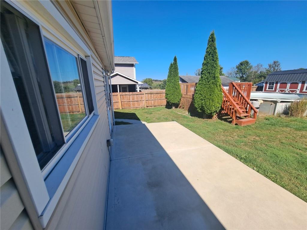 414 Liberty Street Perryopolis, PA 15473 - Photo 6 of 26 a view of a house with a yard