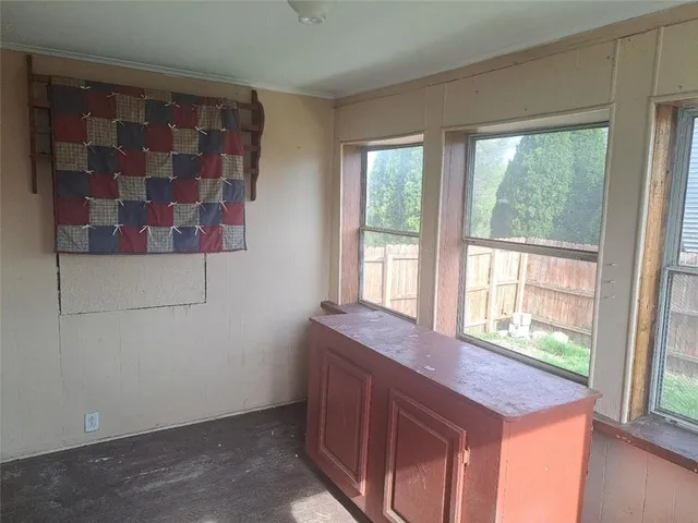 a view of kitchen and hall with wooden floor
