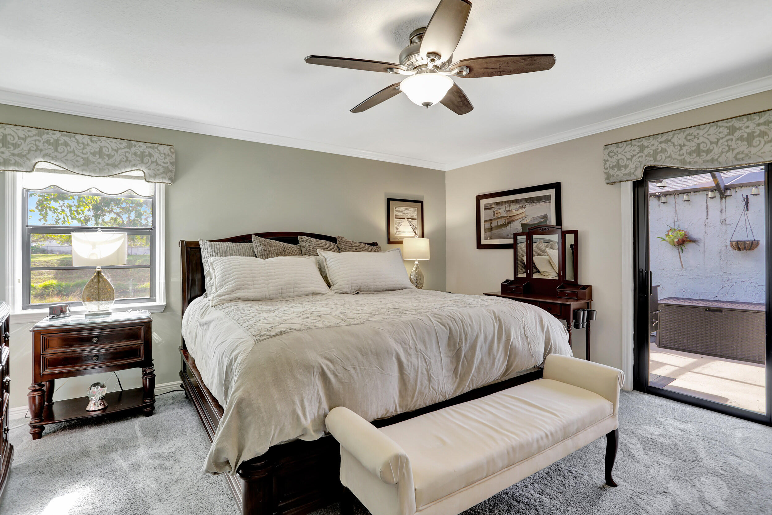 9142 Southwest 22nd Street, Unit E Boca Raton, FL 33428 - Photo 19 of 51 a bedroom with a bed and a tv