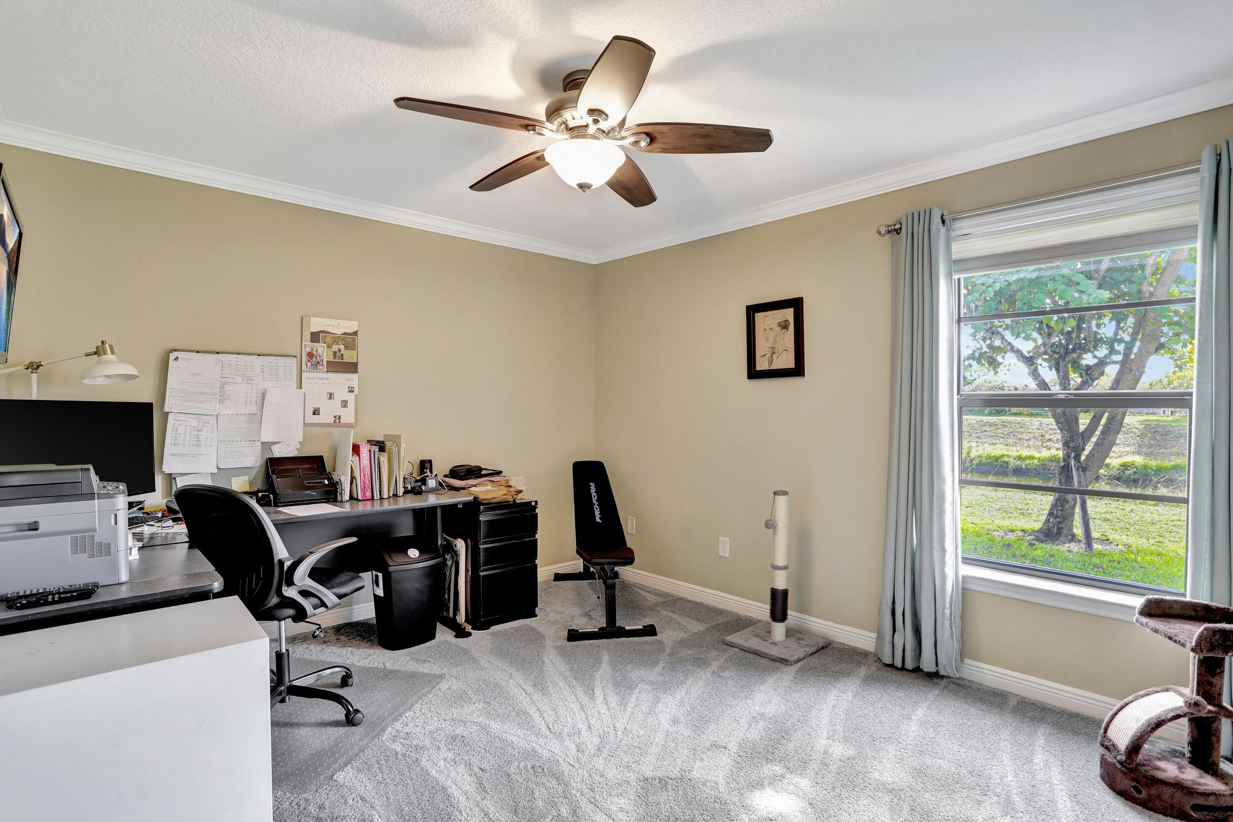 9142 Southwest 22nd Street, Unit E Boca Raton, FL 33428 - Photo 22 of 51 a view of a workspace with furniture and a window