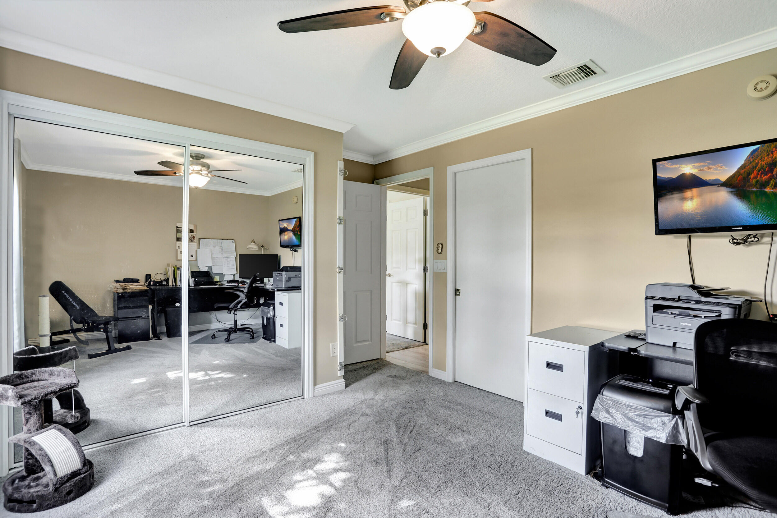 9142 Southwest 22nd Street, Unit E Boca Raton, FL 33428 - Photo 23 of 51 a view of a workspace with furniture and a window