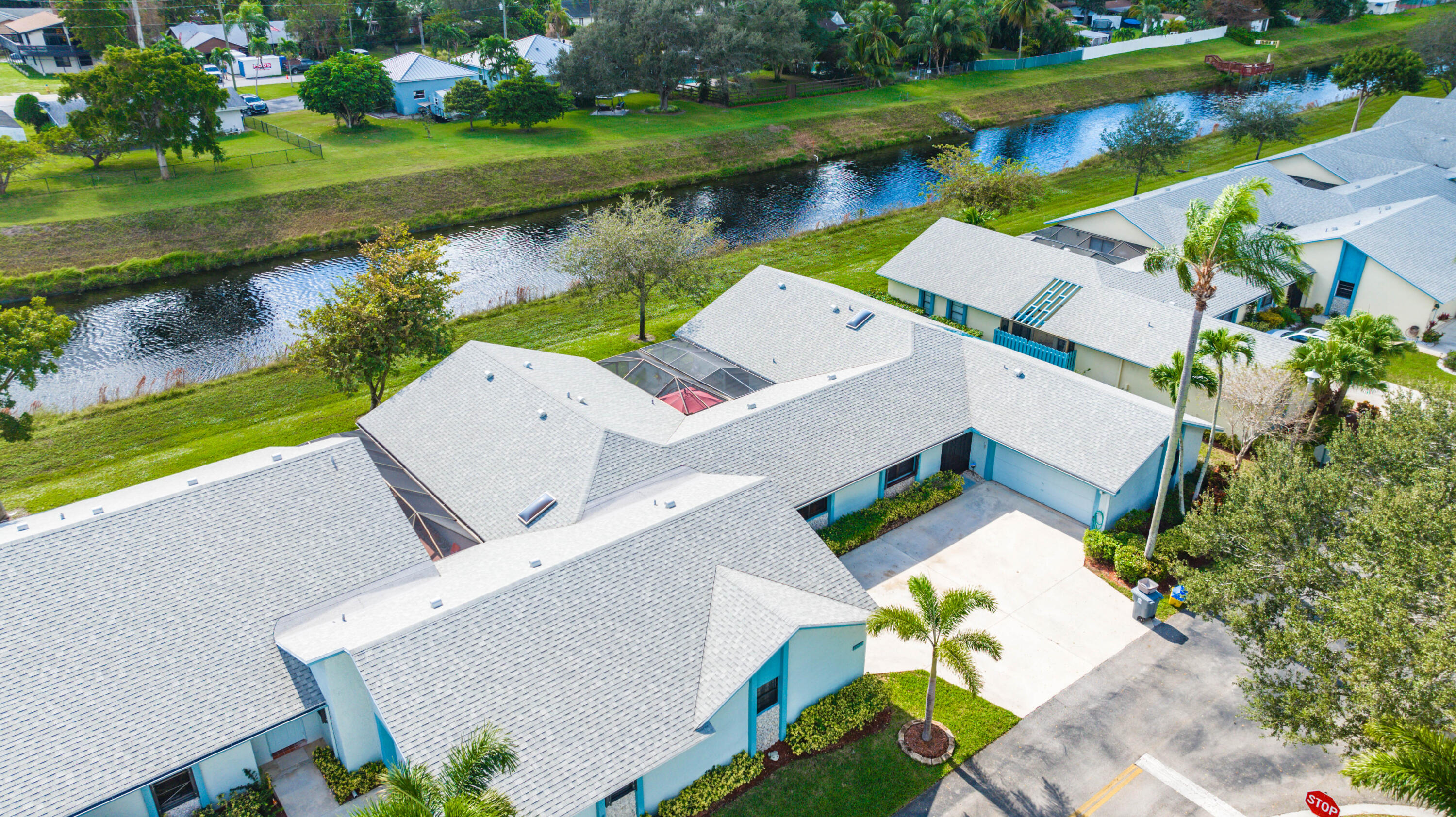 9142 Southwest 22nd Street, Unit E Boca Raton, FL 33428 - Photo 41 of 51 an aerial view of a house with a garden and lake view