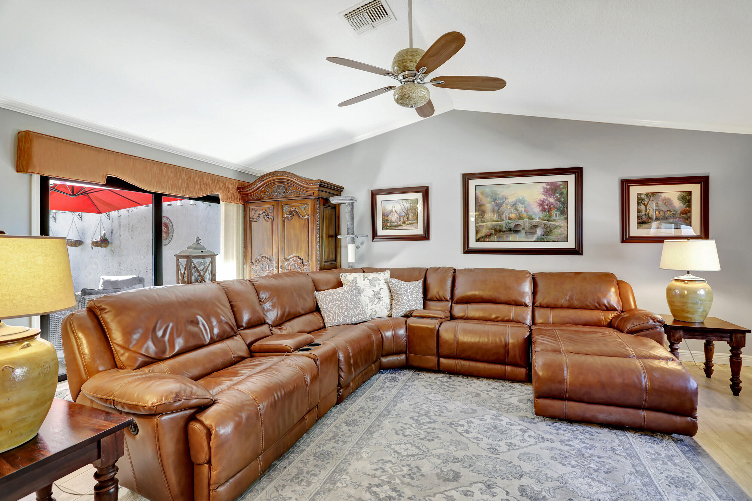 9142 Southwest 22nd Street, Unit E Boca Raton, FL 33428 - Photo 5 of 51 a living room with furniture a bed and a couch