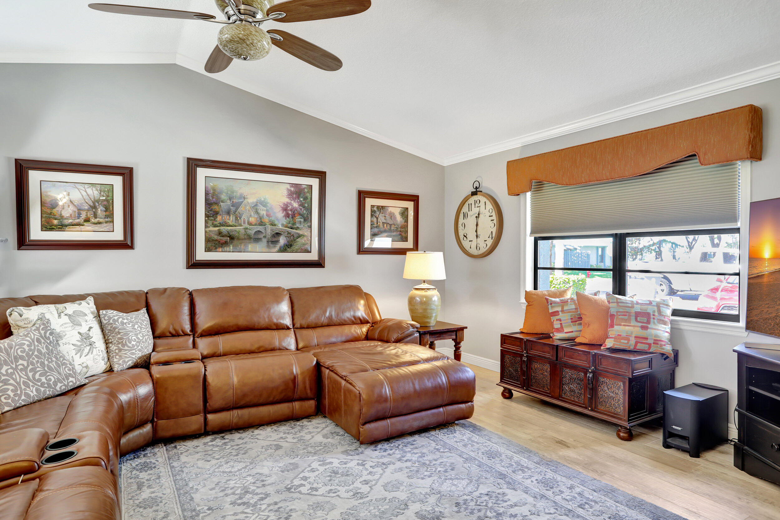 9142 Southwest 22nd Street, Unit E Boca Raton, FL 33428 - Photo 7 of 51 a living room with furniture a rug potted plant and a window
