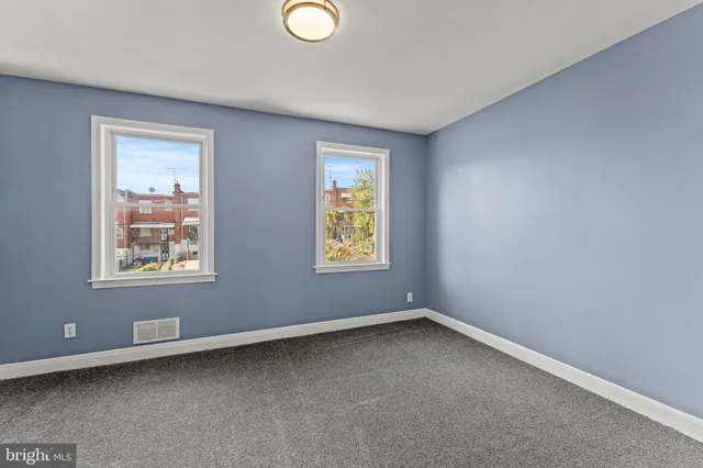 an empty room with windows