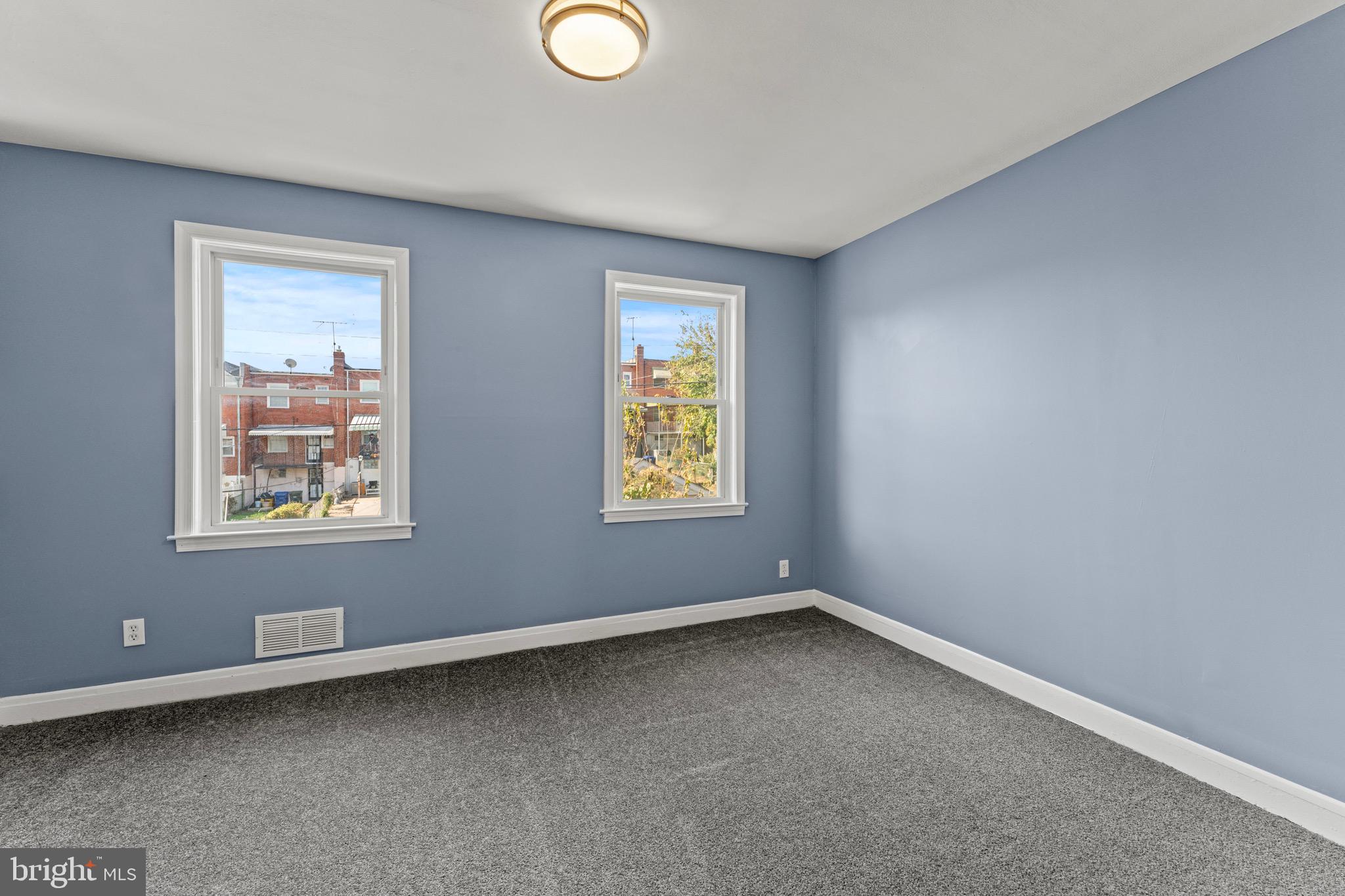 3693 Kenyon Avenue Baltimore, MD 21213 - Photo 14 of 34 an empty room with windows
