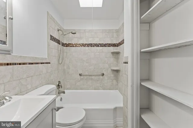 a bathroom with a toilet and a bathtub